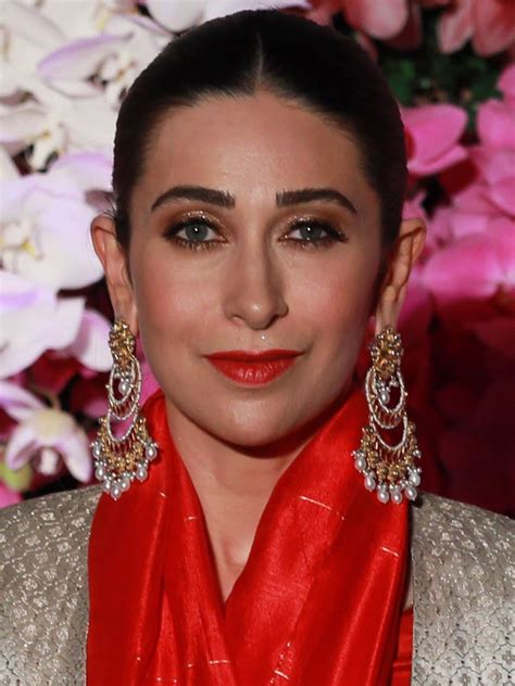 Indian Bollywood actress Karishma Kapoor with her daughter and Varu Dhawan attend the actress Sonam Kapoor Sangeet ceremony in Mumbai on May 7, 2018. INDIA-ENTERTAINMENT-CINEMA-BOLLYWOOD Bollywood actress Karishma Kapoor with director Karan Johar at designer Manish Malhotra's fashion show at Olive, New Delhi.